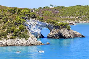 Two boats pass in front of San Felice Arch(Architiello di San Felice), Apulia(Puglia)