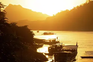 Mekong Prints: Boats at sunset on the Mekong river, Luang Prabang (ancient capital of Laos), Laos