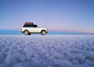 Bolivia, Potosi Department, Daniel Campos Province, White Toyota Landcruiser on the Salar de Uyuni