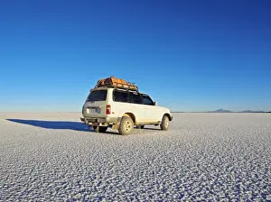 Bolivia, Potosi Department, Daniel Campos Province, White Toyota Landcruiser on the Salar de Uyuni