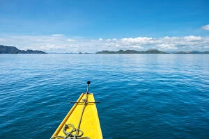Bow of an outrigger boat on blue water in Hidden Lagoon, Coron Island, Palawan