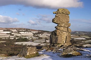 Images Dated 20th July 2017: The Bowermans Nose granite pillar surrounded by some light winter snow, Dartmoor
