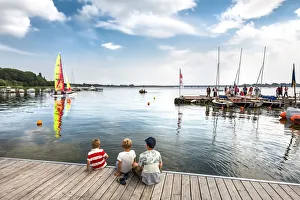 Boys watching a catamaran, Altefaahr, RAogen Island, Mecklenburg-Western Pomerania