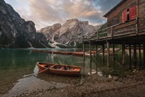 Malga Prints: The Braies lake taking the first light of the day on a calm