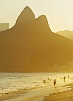 Brazil, City of Rio de Janeiro, Ipanema Beach and Morro Dois Irmaos during sunset