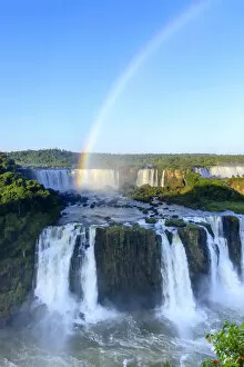 Brazil, Parana state, a rainbow photographed over the Iguacu or Iguazu falls as seen