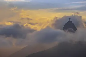 Cover Prints: Brazil, Rio de Janeiro, Christ the Redeemer statue on Corcovado Hill surrounded by golden clouds at sundown