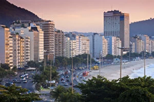 Images Dated 29th July 2010: Brazil, Rio De Janeiro, Copacabana, Traffic along Avenue Atlantica at dawn