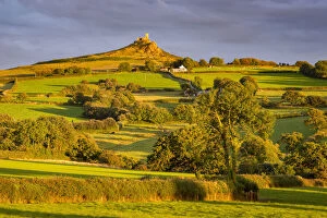 Brentor Church rising above rolling summer countryside, Dartmoor, Devon, England
