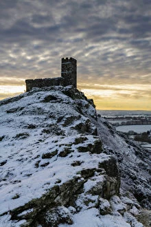 Brentor Church on a snowy outcrop on a winter morning, Dartmoor, Devon, England
