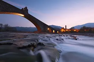 Emilia Romagna Prints: The bridge Gobbo of Bobbio at dusk, Piacenza district, Italy