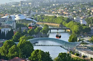 Bridge of Peace and the Mtkvari river. The famous Cable Car above. Tbilisi, Georgia