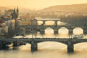 Prague Collection: Bridges over Vltava river in city at sunset, Prague, Bohemia, Czech Republic