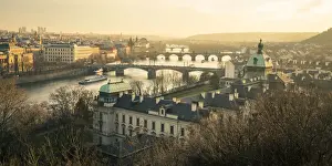 Arch Bridge Prints: Bridges over Vltava river and Straka Academy against sky seen from Letna park at sunset