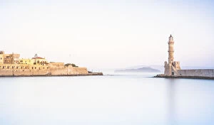 Images Dated 18th October 2021: Bright sunrise over the Venetian lighthouse and Chania old town, Crete, Greece