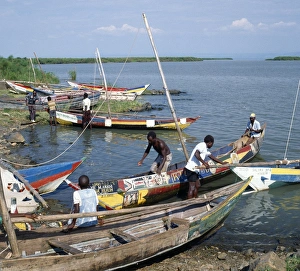 Brightly painted fishing boats of the Luo people find