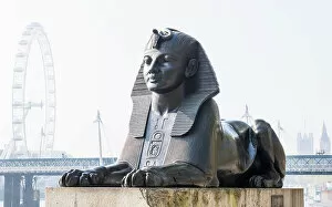 Images Dated 4th January 2023: Bronze Egyptian sphinx statue on the Thames embankment, with The London Eye