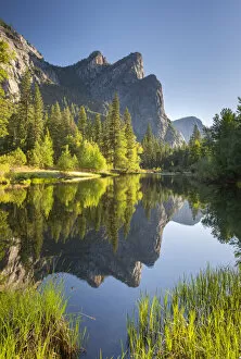 Images Dated 8th April 2022: The Three Brothers mountains reflected in the River Merced in Yosemite Valley