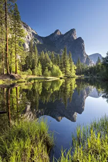 Peaks Gallery: The Three Brothers reflecting in the River Merced in Yosemite Valley, California, USA