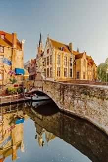 Images Dated 25th November 2019: Bruges old city reflecting in the water canal at sunrise, Belgium