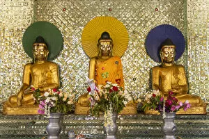 Prayer Gallery: Buddha statues in Shwedagon Pagoda, Yangon, Myanmar