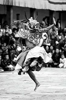 Bhutan Prints: Buddhist monk performing traditional masked dance at the Wangdue Phodrang Tsechu