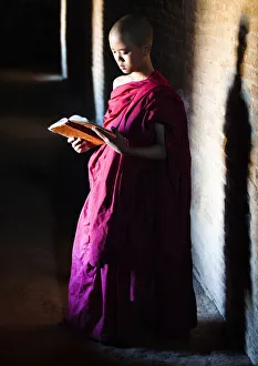 Images Dated 29th April 2013: A buddhist monk praying in the temple, Bagan, Burma / Myanmar