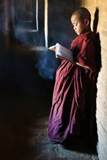 Images Dated 29th April 2013: A buddhist monk praying in the temple, Bagan, Burma / Myanmar