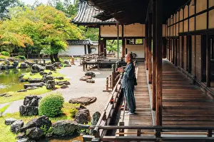 Lifestyle Prints: Buddhist monk prays in front of the Japanese zen garden of Daigo-ji Temple, Kyoto, Japan