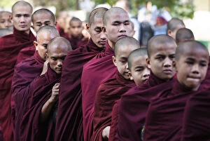 Images Dated 20th May 2013: Buddhist monks lining up for lunch at Mahagandayon Monastery, largest Buddhist monastery