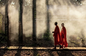 Bac Lieu Prints: Two Buddhist monks walking through smoke from smouldering leaves