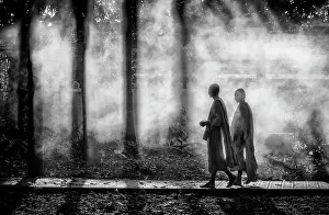 B And W Prints: Two Buddhist monks walking through smoke from smouldering leaves