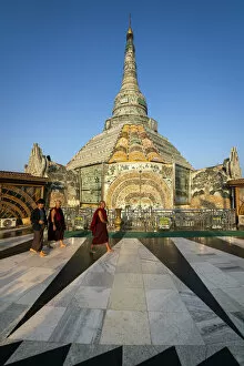 Images Dated 12th August 2020: Buddhist monks walking by Werawsana Jade Pagoda (AKA Verochana Jade Pagoda