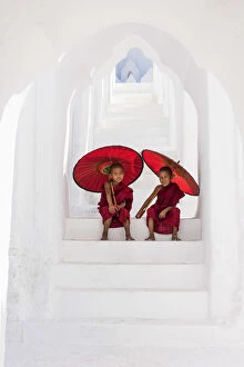 White Gallery: Two Buddhist novice monks on the steps of the white pagoda of Hsinbyume (Myatheindan)