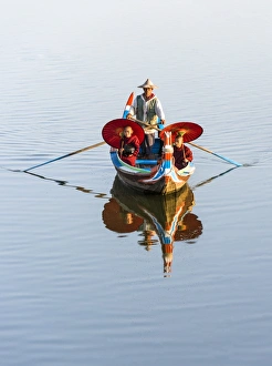 Buddhist novice monks on the Taungthaman Lake, Mandalay, Myanmar
