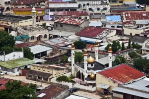 Development Prints: Bujumbura, Burundi. A gilded Mosque shines in the run down Asian quarter
