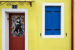 Burano, Venice, Veneto, North East Italy, Europe. Colored facade in Burano