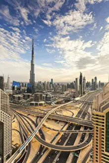 Images Dated 19th March 2015: The Burj Khalifa Dubai, elevated view across Sheikh Zayed Road and Financial Centre