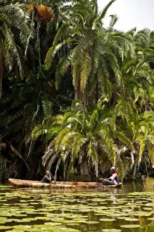 Burundi. Locals fish on the The Lac des Oiseaux which is home to numerous species