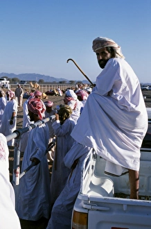 Head Dress Prints: A bystander watches the proceedings at the start of