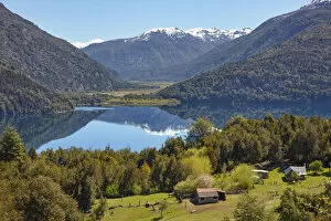Cabins on Lake Rivadavia, with the Andes mountains in background, Los Alerces National Park, Chubut, Patagonia