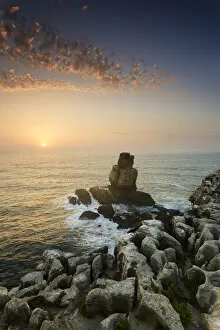 Cabo Carvoeiro and Nau dos Corvos at sunset, in front of the Atlantic Ocean. Peniche