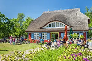Prerow Prints: Cafe in historic thatched roof house in Prerow