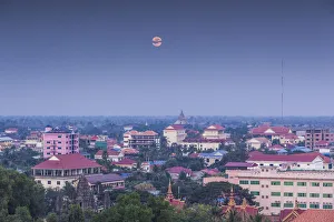 Battambang Prints: Cambodia, Battambang, elevated city view and moonrise, dusk