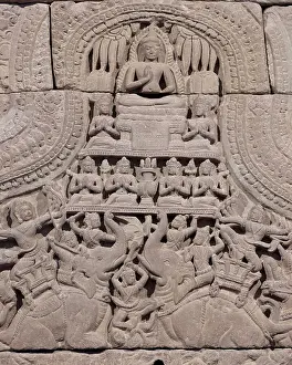 Cambodia Prints: Cambodia, detail of a Khmer carving from Angkor Wat showing a seated buddha in the Vitarka Mudra