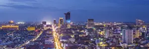 Cambodia Prints: Cambodia, Phnom Penh, elevated city skyline along Monivong Boulevard, dusk