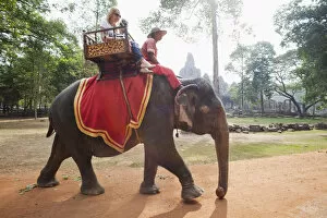 Images Dated 18th February 2011: Cambodia, Siem Reap, Angkor Thom, Bayon Temple, Tourists on Elephant