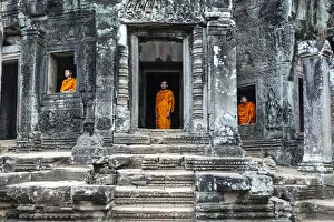 Images Dated 24th June 2014: Cambodia, Siem Reap, Angkor Wat complex. Monks inside Bayon temple (MR)