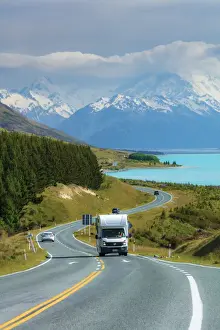 Outdoor Activity Prints: A camper driving along the highway running near Pukaki lake with Mount Cook (Aoraki