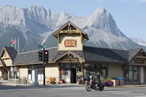 Main Street Prints: Canada, Alberta, Canmore, biker on main street